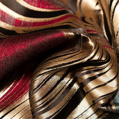 Abstract wave embroidered black satin duvet cover set with richly textured fabric in deep red metallic gold and black stripes