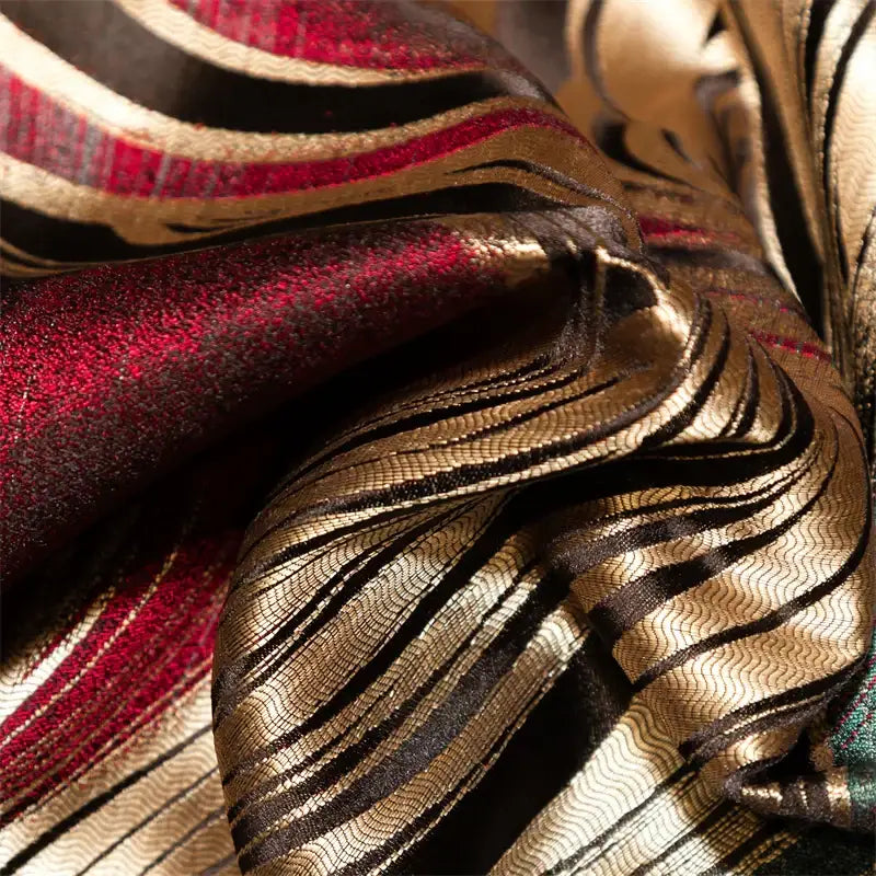 Abstract wave embroidered black satin duvet cover set with richly textured fabric in deep red metallic gold and black stripes