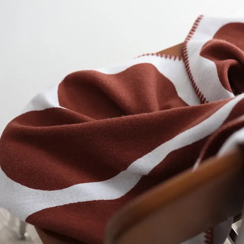 Cozy rust-colored decorbites jacquard imitation cashmere throw blanket with white wavy stripes and red stitching border