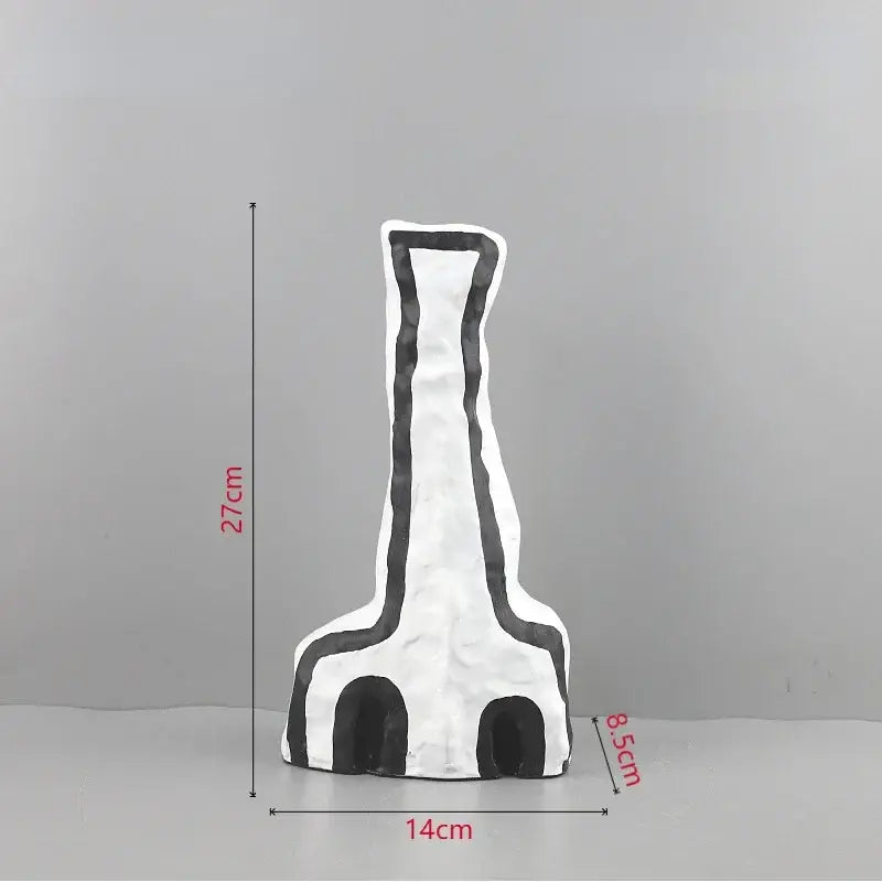 Abstract white and black geometric eye pattern vase with textured matte finish for living room decor
