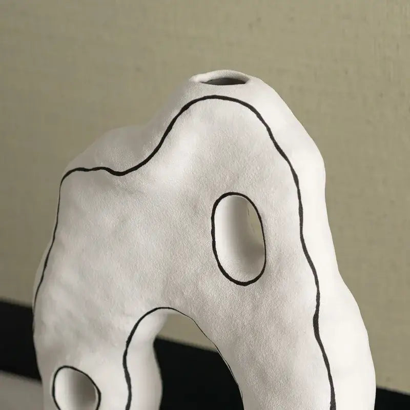 Abstract white and black geometric ceramic vase with organic contours for living room decorbites geometric ceramic decor