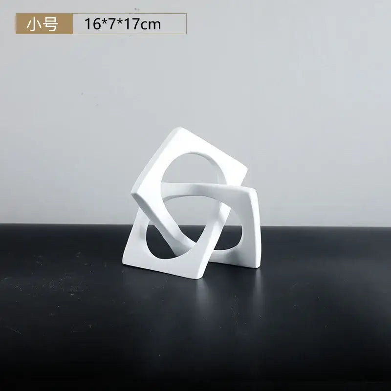Abstract white ceramic geometric cross square ring bookends featuring interlocking square shapes for living room decorbites geometric cross