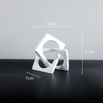 Abstract white ceramic geometric cross square ring bookends featuring interlocking square shapes for living room decorbites geometric cross