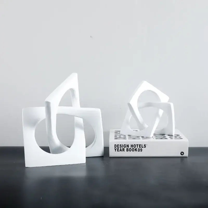 White ceramic bookends with abstract geometric cross square ring design for living room decorbites geometric cross decor