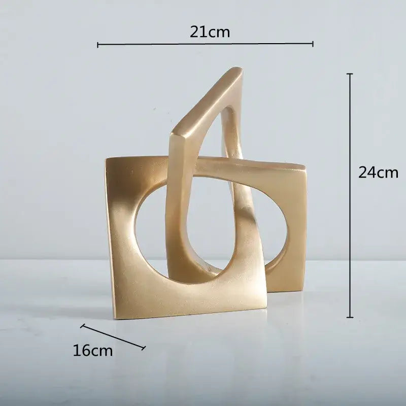 Gold-colored abstract ceramic geometric cross square ring bookends featuring interlocking shapes for living room decorbites geometric cross