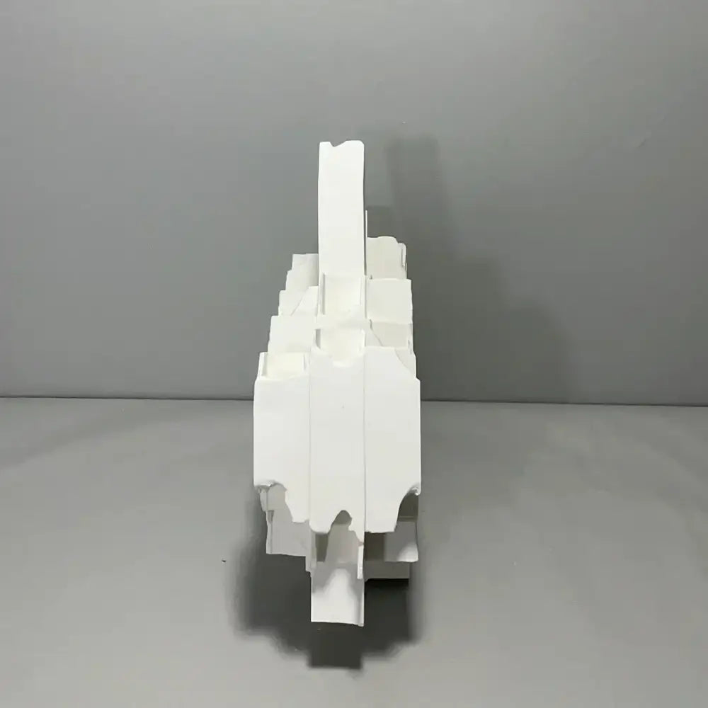 White abstract sculpture vase made of layered geometric cardboard pieces for decorbites geometric ceramics flower decor
