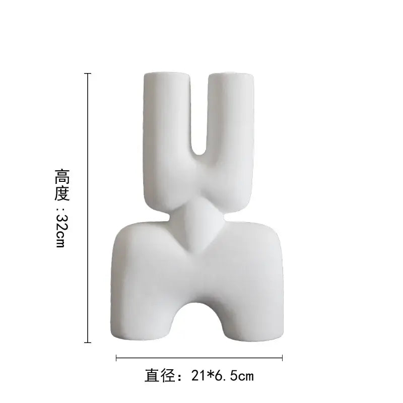 White ceramic vase with a distinctive u-shaped sculptural form for living room decor by decorbites geometric ceramic vase
