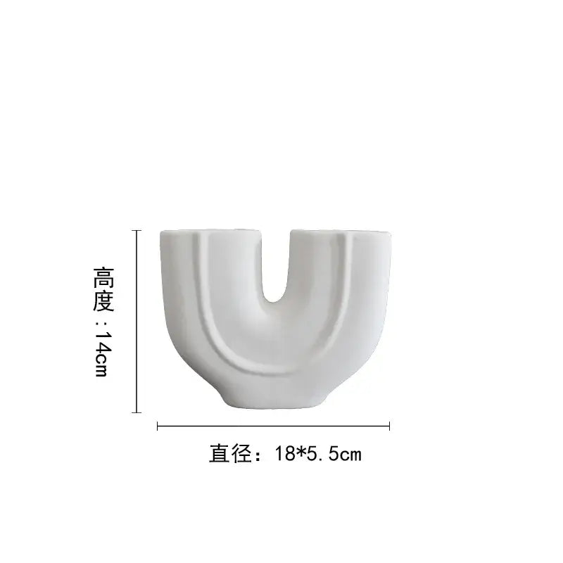 Abstract white geometric ceramic vase with a minimalist u-shaped design and glossy finish for living room decorbites decor