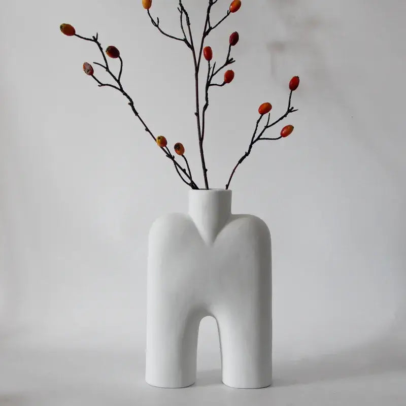 Abstract white geometric ceramic vase shaped like a stylized human torso with arched base for living room decorbites decor