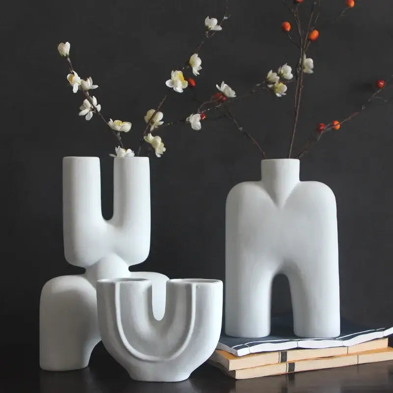 Abstract white geometric ceramic vase with smooth surfaces and human-like forms for living room decor by decorbites