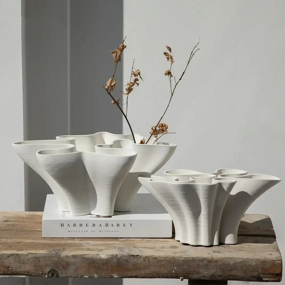 Abstract white geometric fold ceramic vase with organic flowing forms and textured surfaces for living room decorbites geometric fold decor