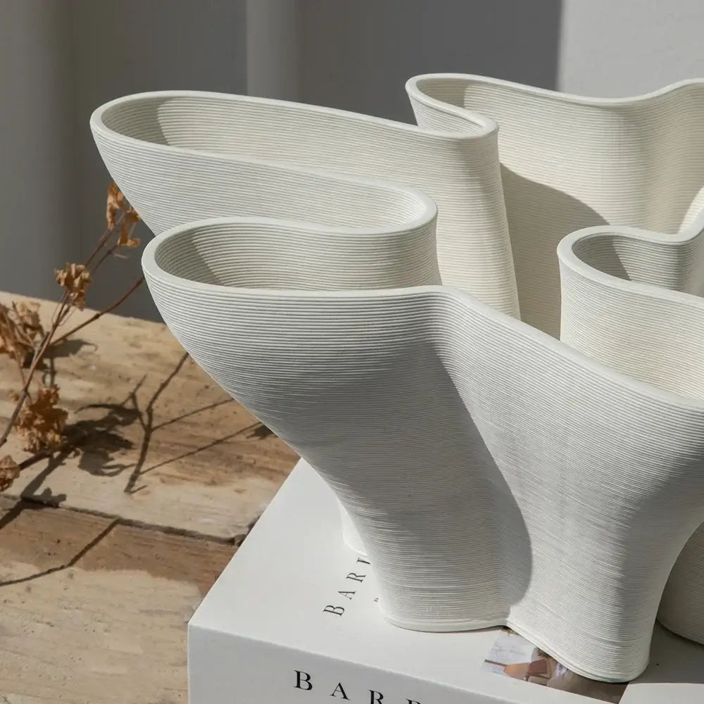Abstract white geometric fold ceramic vase with flowing organic curves and textured surface for living room decorbites geometric fold decor