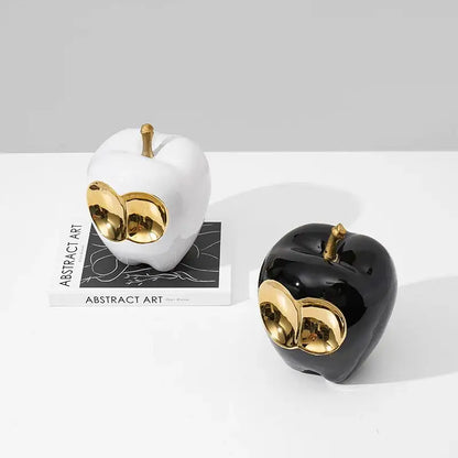 Abstract white and gold ceramic apple sculpture with black accents and golden apple details for living room decor