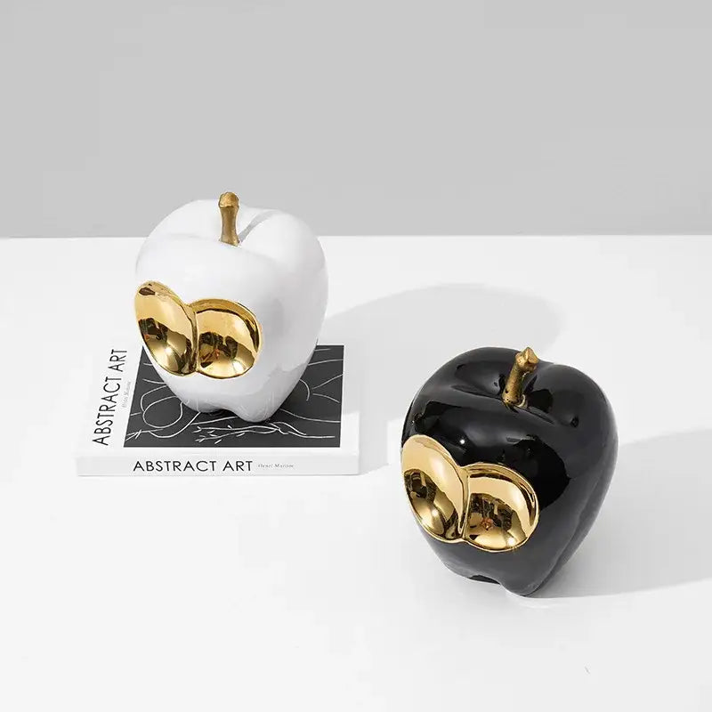 Abstract white and gold ceramic apple sculpture with black accents and golden apple details for living room decor