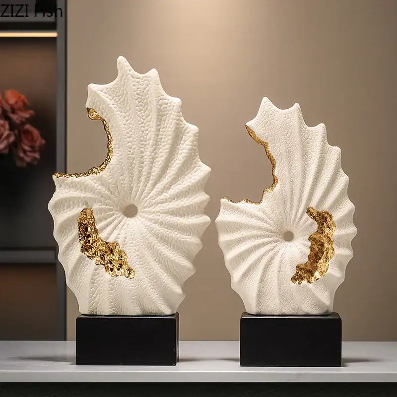 Abstract white and gold gilded ceramic landscape shell sculptures mounted on black bases for living room decor