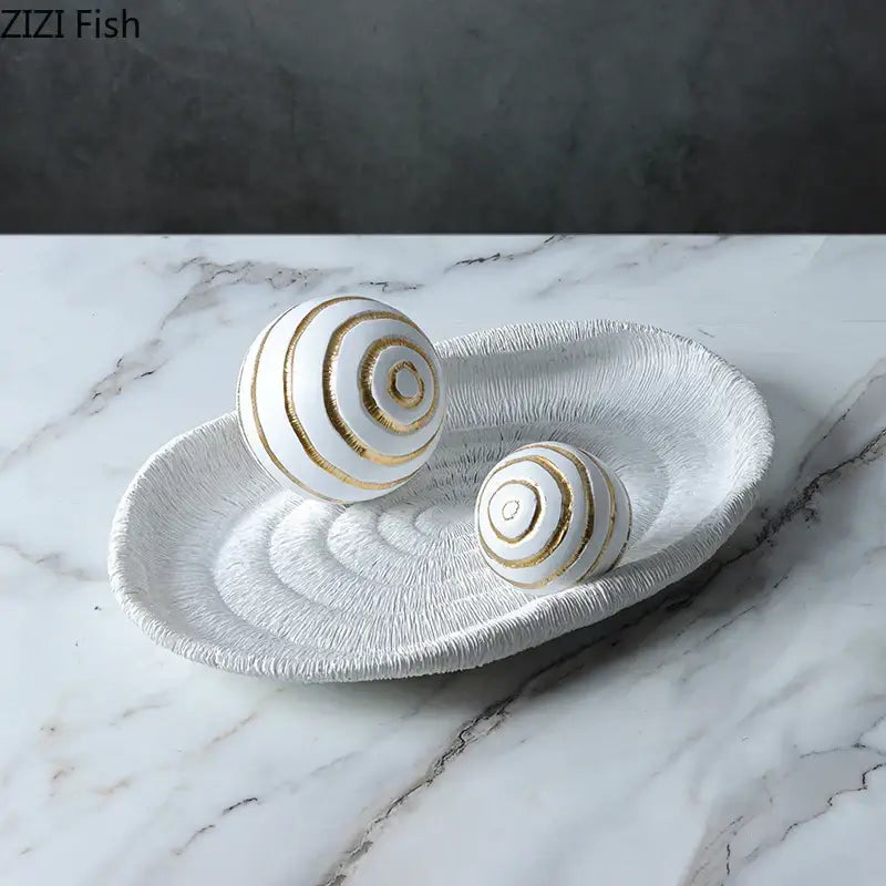 Abstract white ceramic tray with textured spiral ridges and two white golden texture balls for living room decor