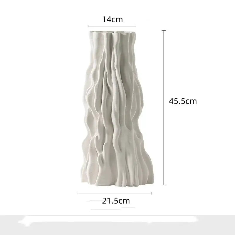 A tall off-white ceramic vase with an irregular trunk fold texture resembling natural rock formations for living room