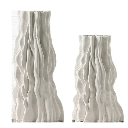 Two off-white ceramic vases with irregular trunk fold texture resembling draped fabric for living room decor