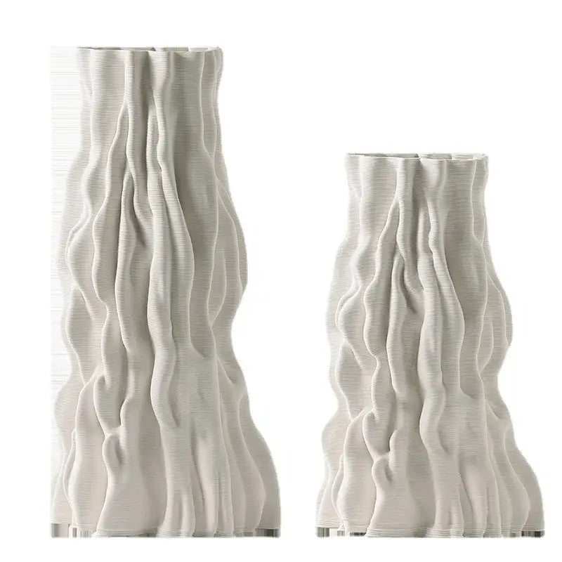 Two off-white ceramic vases with irregular trunk fold texture resembling draped fabric for living room decor