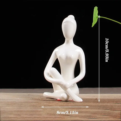 White ceramic abstract yoga figure of seated woman in meditative pose porcelain decorbites living room sculpture