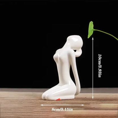 White ceramic abstract yoga figure with smooth glossy finish for living room decor by decorbites