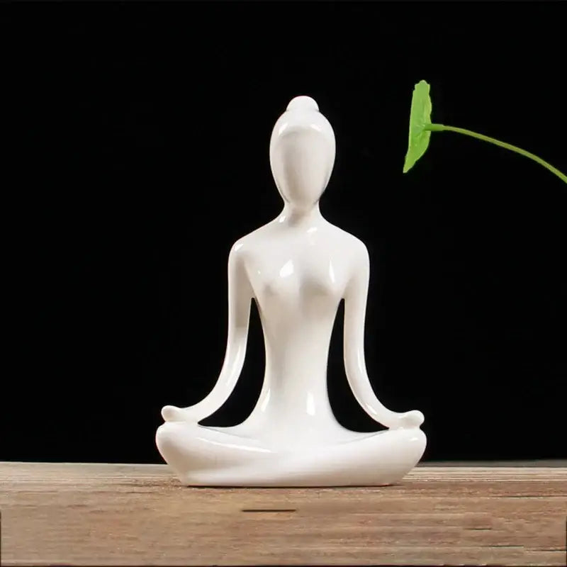 White ceramic yoga figure in meditative pose abstract porcelain sculpture for living room decorbites abstract yoga figure