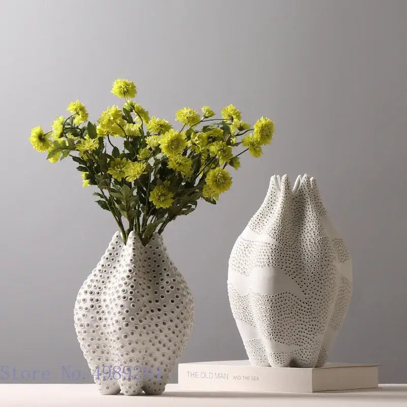 Abstract white ceramic vase with textured dot pattern and organic sculpted shape for living room decorbites decor