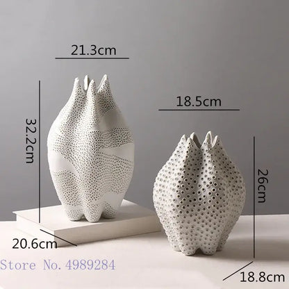 Abstract white textured ceramic vase with perforated petal shapes featuring decorbites dot pattern for living room decor