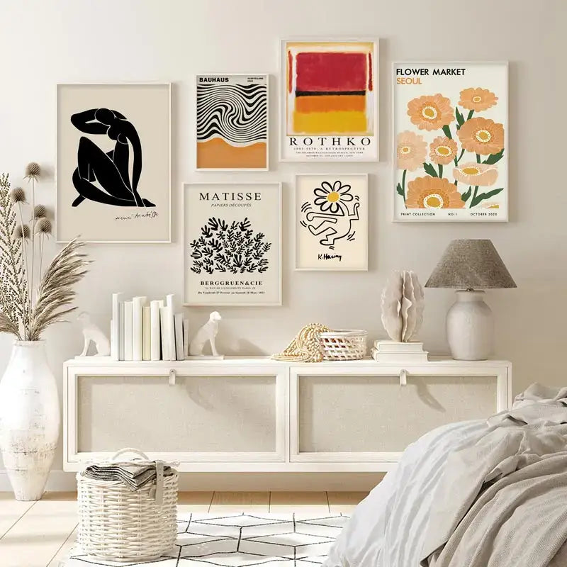 A collection of six framed abstract yayoi kusama wall art prints featuring bold black white orange red and yellow designs