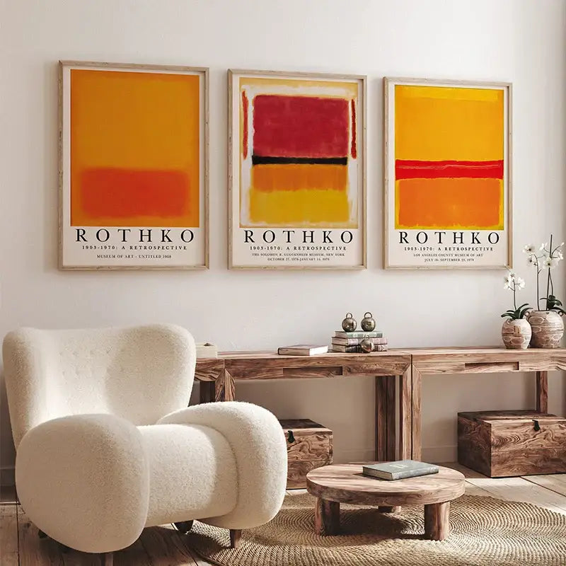 Three framed abstract yayoi kusama wall art prints with bold orange red and yellow blocks in minimalist wooden frames