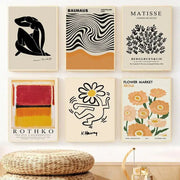 Six framed abstract yayoi kusama wall art prints featuring stylized flower designs in black white orange red yellow and beige tones