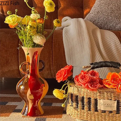 Glossy hand-blown glass vase with red and amber gradient and gold handles for ceramic vase plant pots decor