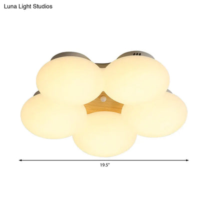 وحدة إضاءة LED نورديك من DecorBites™ مصنوعة من الأكريليك بتصميم زهور ولمسة نهائية بيضاء/خشبية