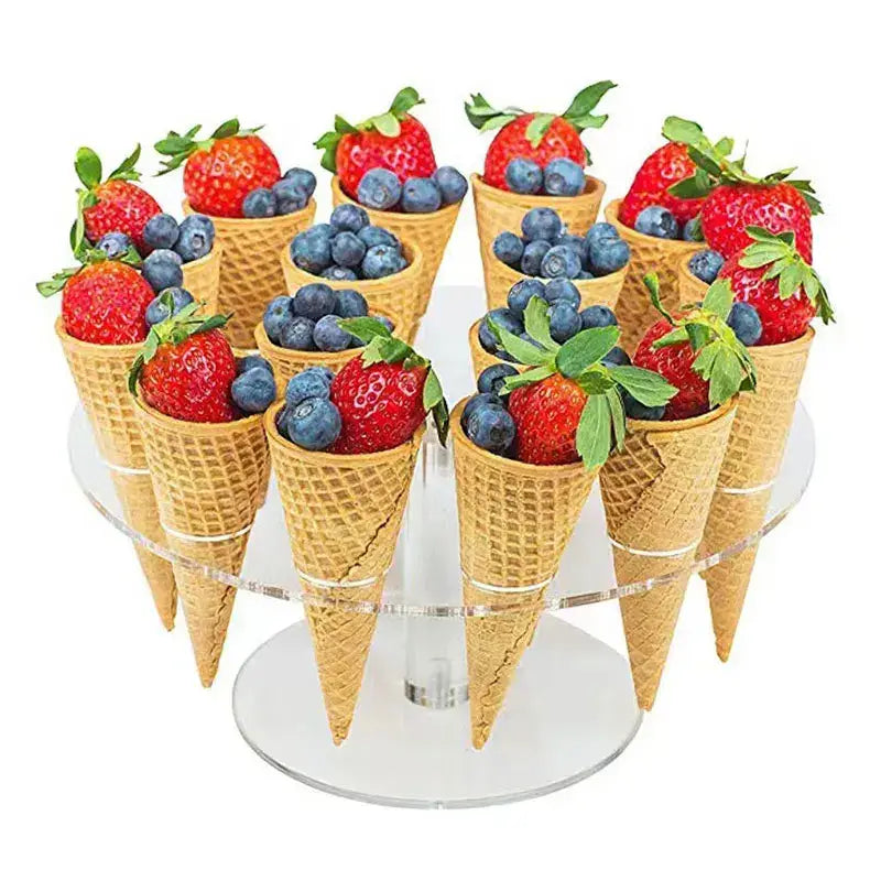 Acrylic ice cream cone holder rack displaying golden waffle cone ice cream cones filled with strawberries and blueberries
