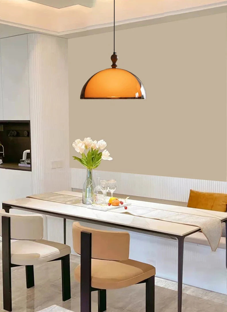 Warm amber glass acrylic pendant light featuring a dark wood lampshade and wooden suspension fixture