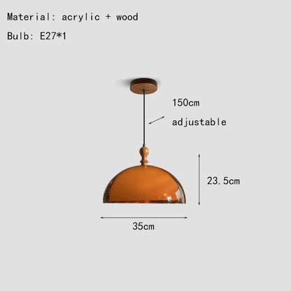A warm amber acrylic pendant light with a dark wood lampshade and wooden ceiling mount