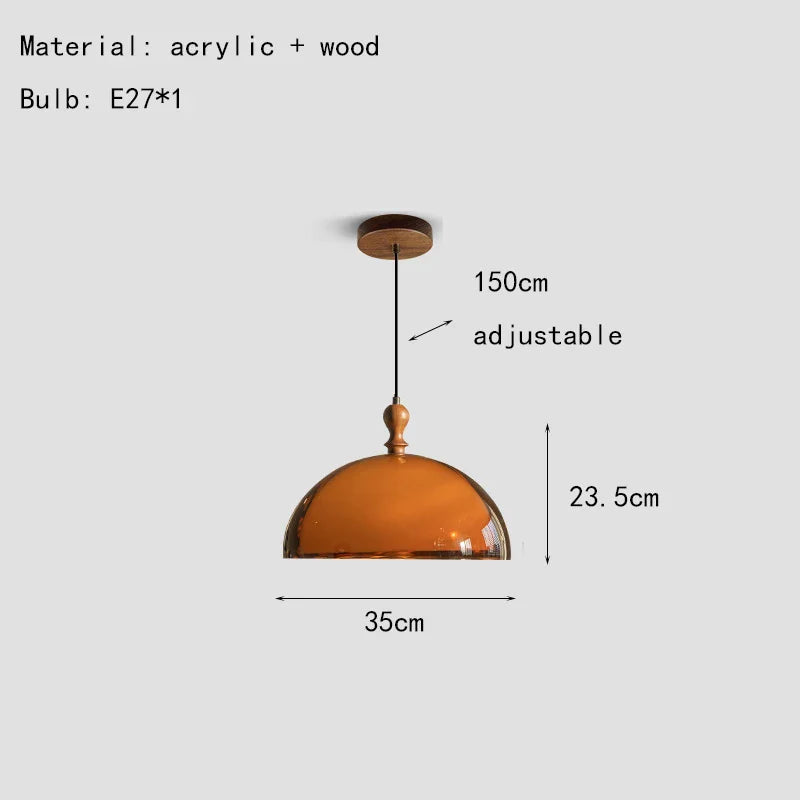 A warm amber acrylic pendant light with a dark wood lampshade and wooden ceiling mount
