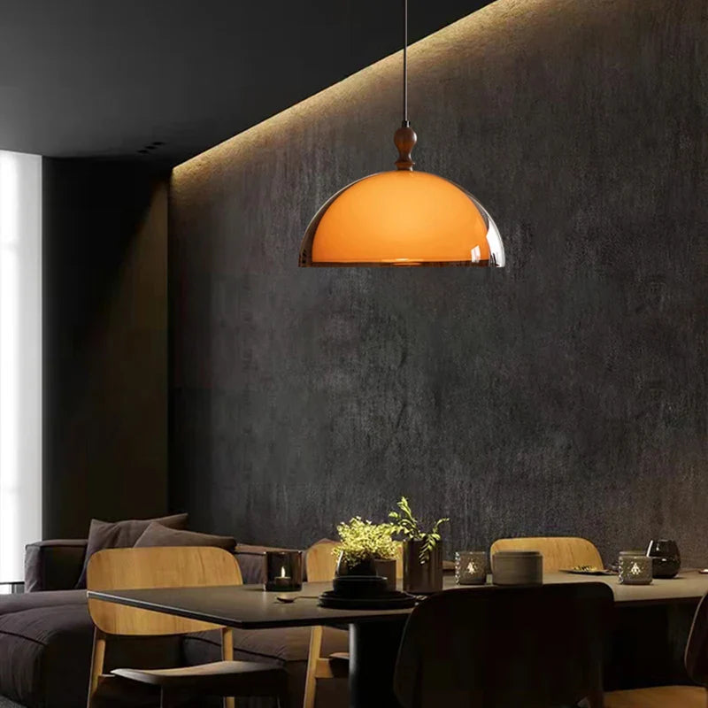 Warm amber glass acrylic pendant light with polished metal rim and dark wood lampshade suspension fixture