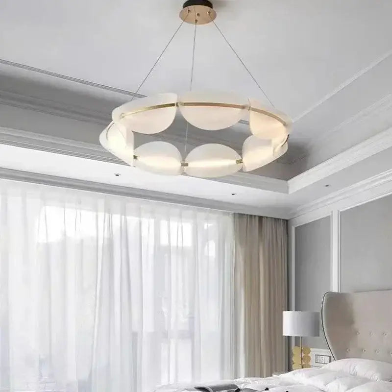 Modern decorbites™ acrylic ring chandelier with frosted glass panels and gold-toned accents for dining room lighting