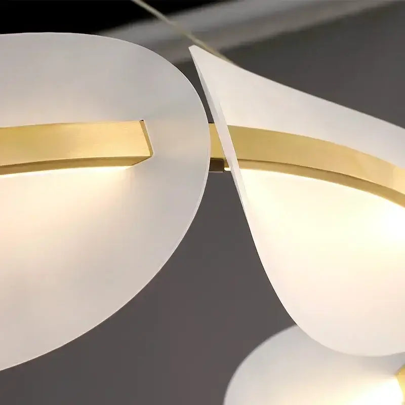 Modern decorbites™ acrylic ring chandelier with white frosted glass shades and gold-toned metal accents for dining room