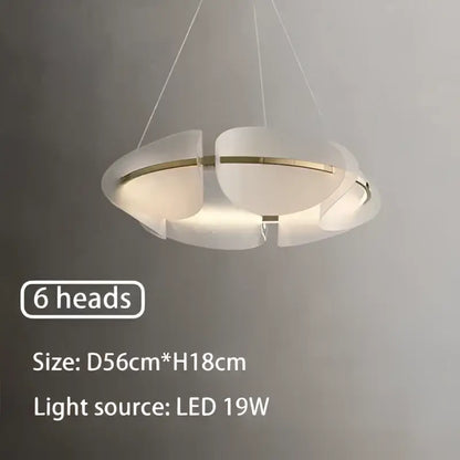 Modern white acrylic ring chandelier with six circular led heads and a sleek dimmable design for dining room use