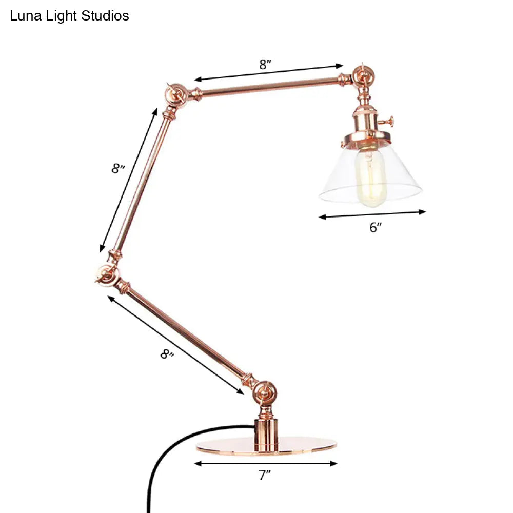 Lámpara de mesa industrial con brazo ajustable y pantalla de cristal transparente - Acabado negro/latón