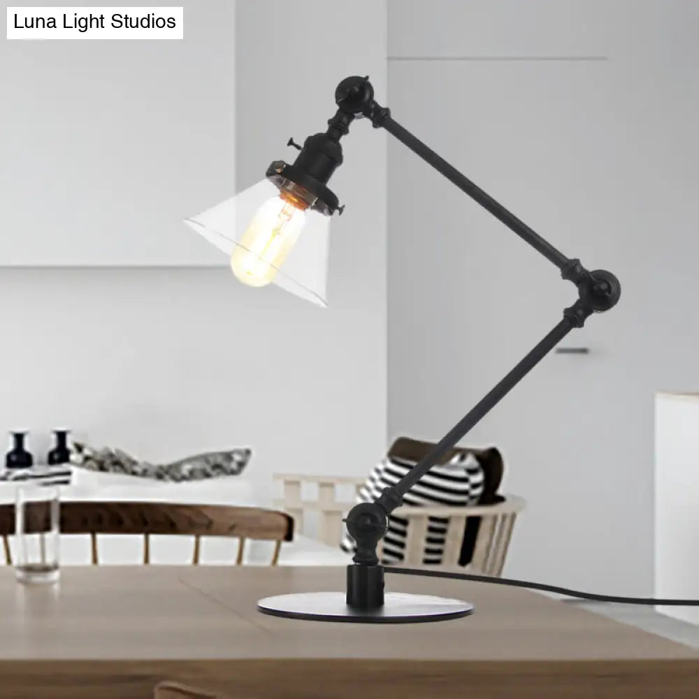 Lámpara de mesa industrial con brazo ajustable y pantalla de cristal transparente - Acabado negro/latón