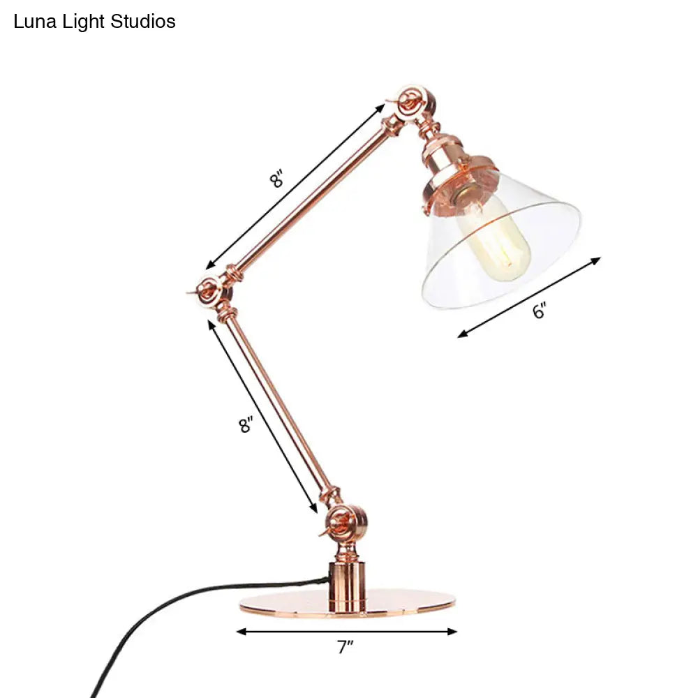 Lámpara de mesa industrial con brazo ajustable y pantalla de cristal transparente - Acabado negro/latón