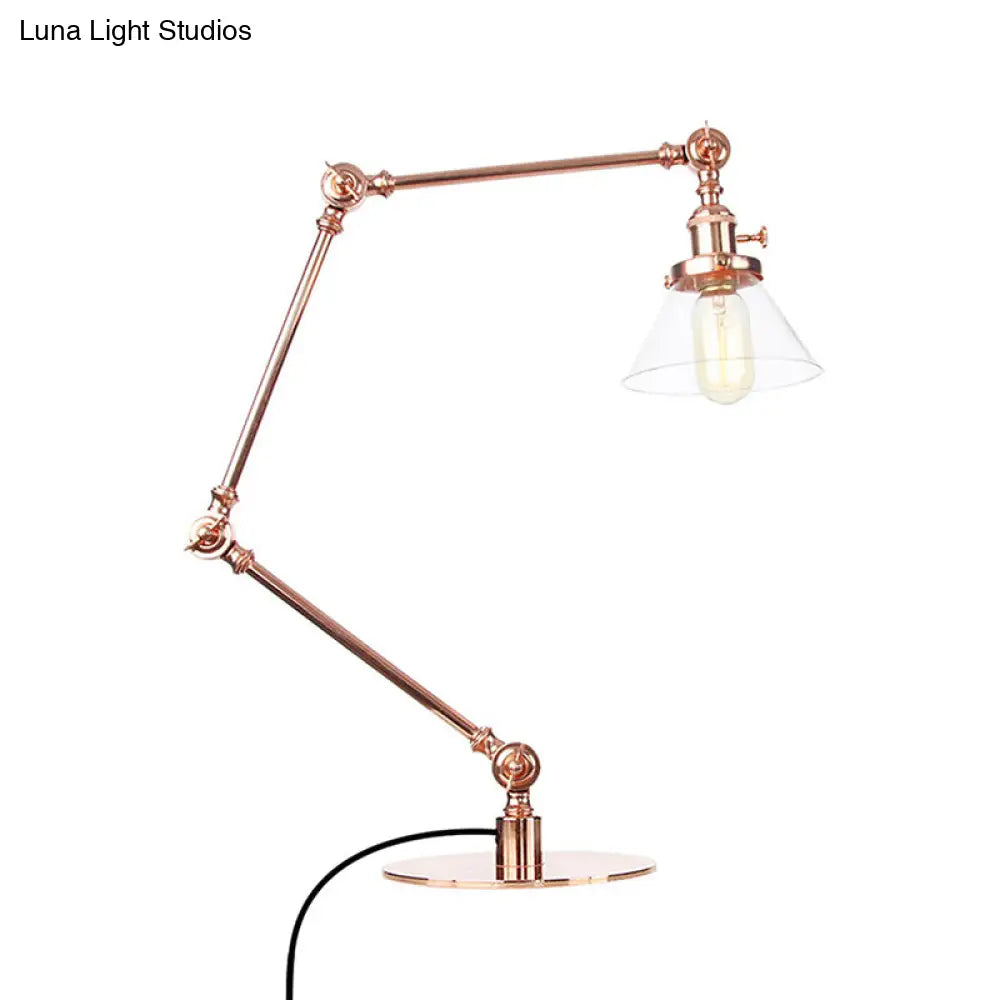 Lámpara de mesa industrial con brazo ajustable y pantalla de cristal transparente - Acabado negro/latón