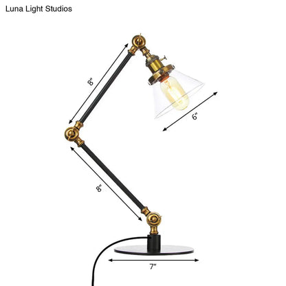 Lámpara de mesa industrial con brazo ajustable y pantalla de cristal transparente - Acabado negro/latón