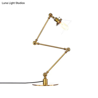 Lámpara de mesa industrial con brazo ajustable y pantalla de cristal transparente - Acabado negro/latón