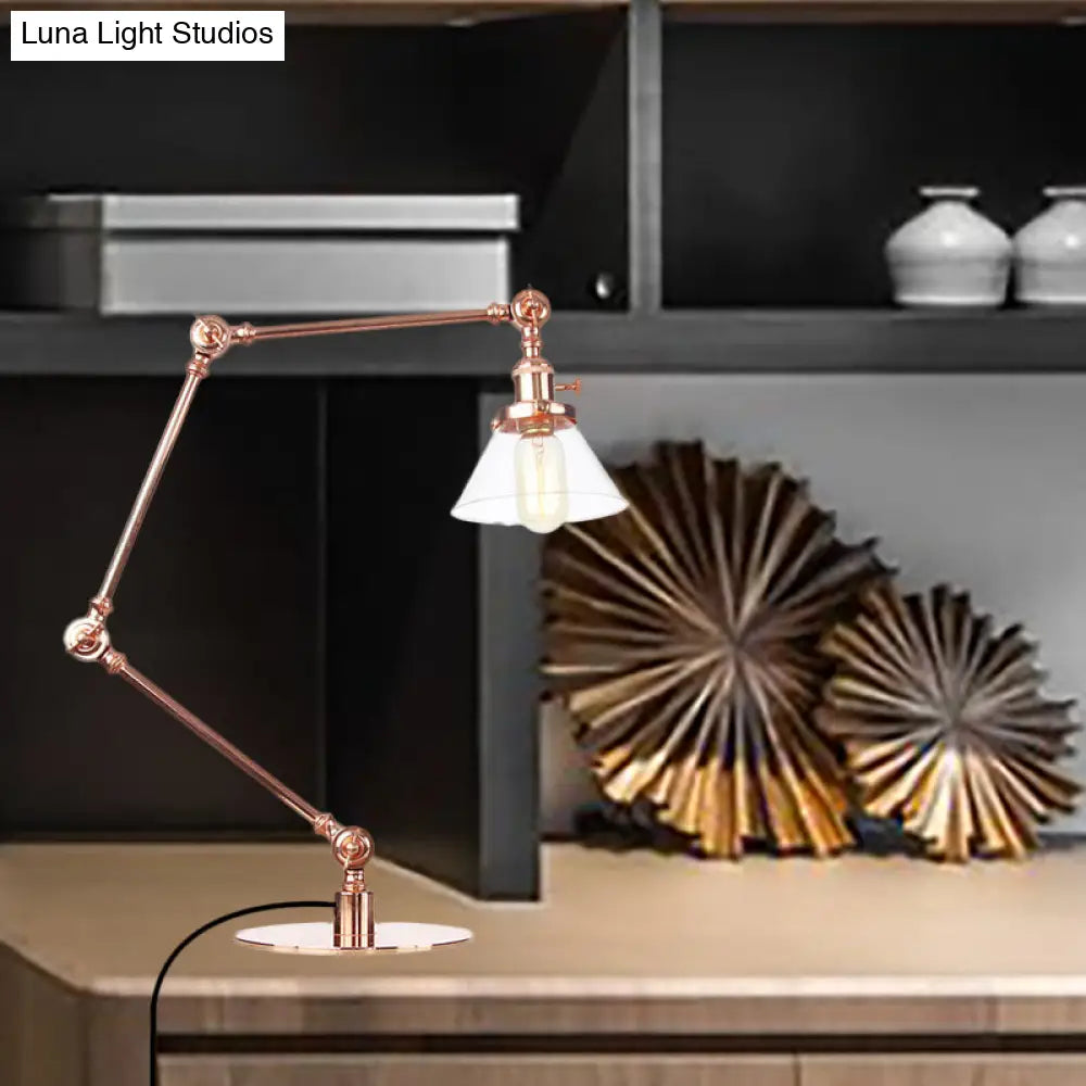 Lámpara de mesa industrial con brazo ajustable y pantalla de cristal transparente - Acabado negro/latón