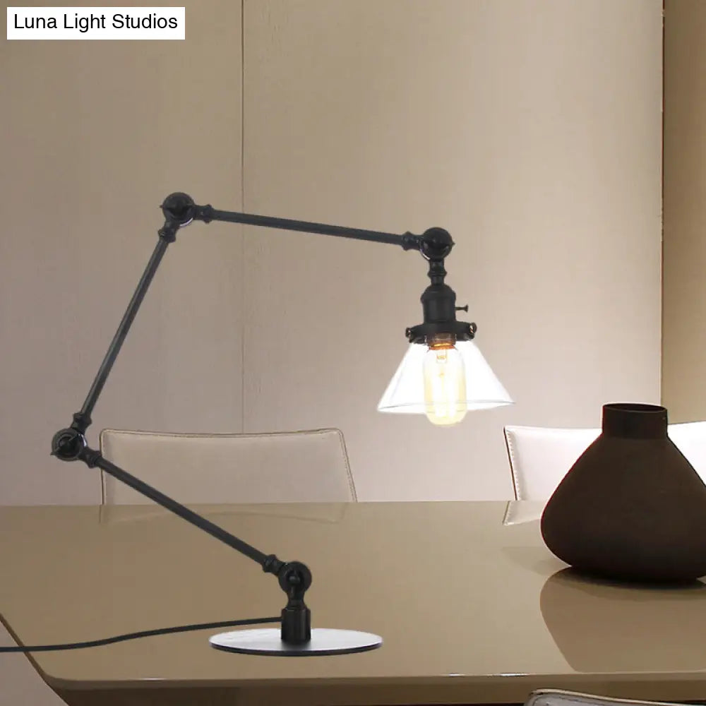 Lámpara de mesa industrial con brazo ajustable y pantalla de cristal transparente - Acabado negro/latón