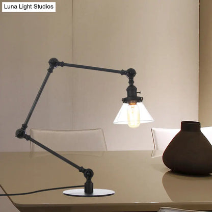 Lámpara de mesa industrial con brazo ajustable y pantalla de cristal transparente - Acabado negro/latón